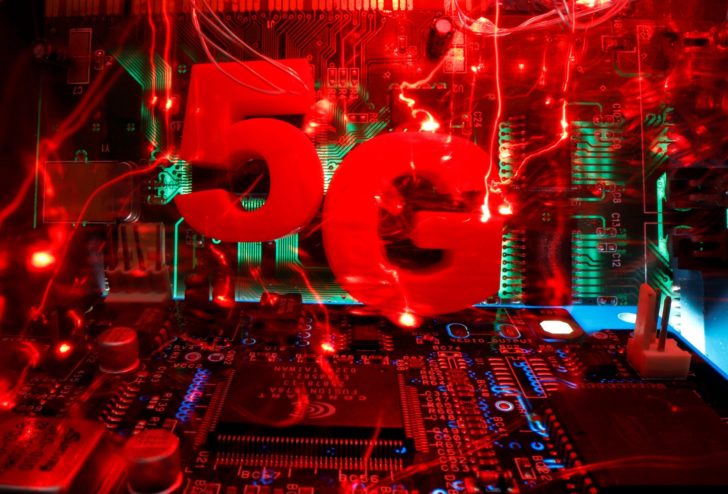 3d printed objects representing 5G are put on a motherboard in this picture illustration