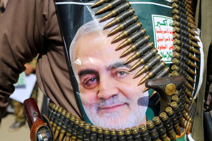 FILE PHOTO: A supporter of the Houthis has a poster attached to his waist of Iranian Major-General Qassem Soleimani, head of the elite Quds Force, who was killed in an air strike at Baghdad airport, during a rally to denounce the U.S. killing, in Saada