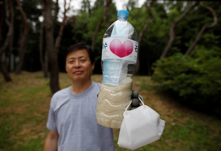 North Korean defector group prepares plastic bottles filled with rice and masks to be sent towards North Korea