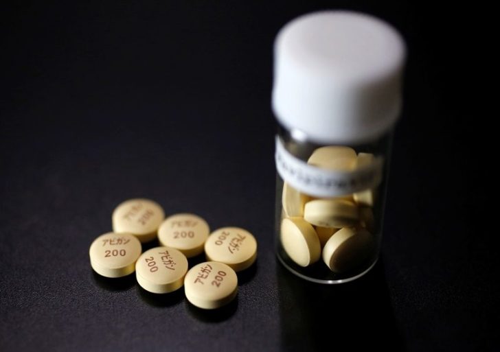 FILE PHOTO: Tablets of Avigan (generic name : Favipiravir), a drug approved as an anti-influenza drug in Japan and developed by drug maker Toyama Chemical Co, a subsidiary of Fujifilm Holdings Co. are displayed during a photo opportunity in Tokyo