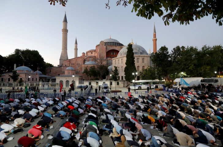 People gather in front of the Hagia Sophia or Ayasofya, after a court decision that paves the way for it to be converted from a museum back into a mosque, in Istanbul