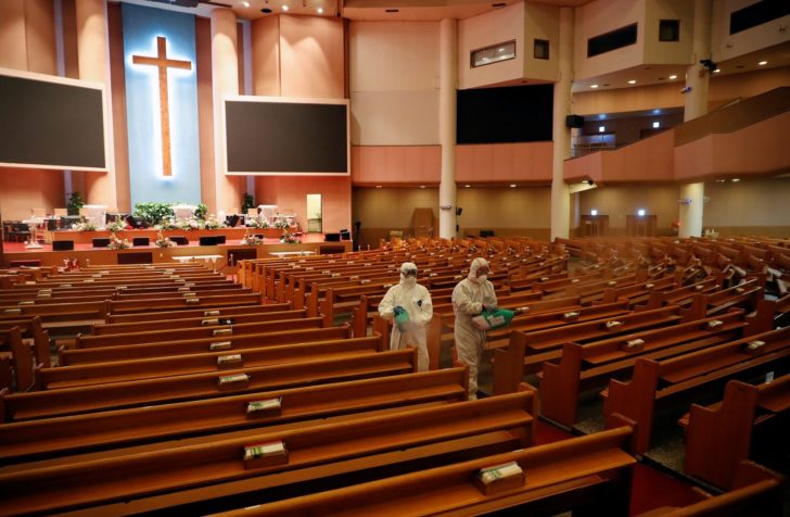 Members of a disinfection company sanitise the Yoido Full Gospel Church, which is the largest church in the country, in Seoul