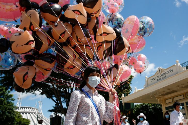 FILE PHOTO: Social distance at Disneyland after it reopened for the first time following a shutdown due to the coronavirus in Hong Kong