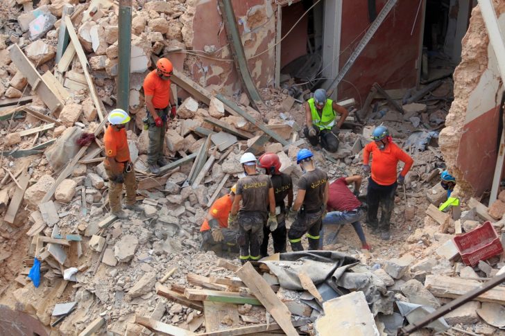 Rescue team search through rubble of buildings damaged due to the massive explosion at Beirut's port area