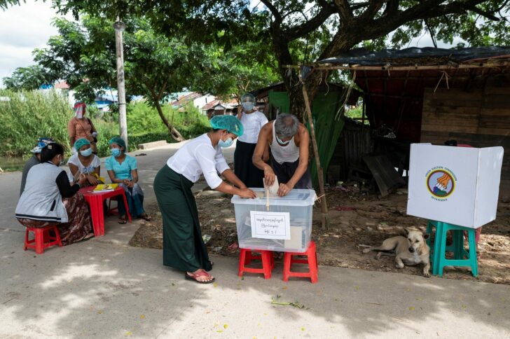 A man cast his ballot during the early voting in Yangon