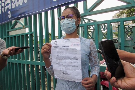 Ley Leak, a former deputy from the dissolved Cambodia National Rescue Party, arrives at the court for the treason trial of more than 100 opposition figures, in Phnom Penh