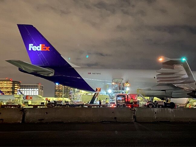 A plane of FedEx Express carrying a first batch of Pfizer/BioNTEch COVID-19 vaccine is seen at LAX Airport, in Los Angeles