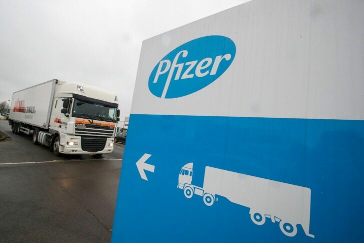 FILE PHOTO: A refrigerated truck leaves the Pfizer plant in Puurs
