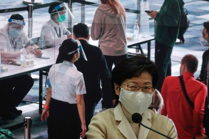 Hong Kong Chief Executive Carrie Lam wearing a mask attends a news conference on government's strategy for COVID-19 vaccinations, in Hong Kong