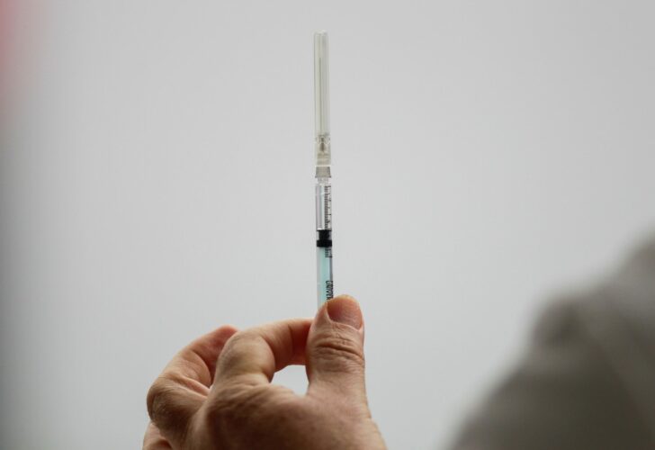 A medical worker holds an injection with a dose of the Pfizer-BioNTech COVID-19 vaccine at the Regional Military Specialty Hospital in San Nicolas de los Garza