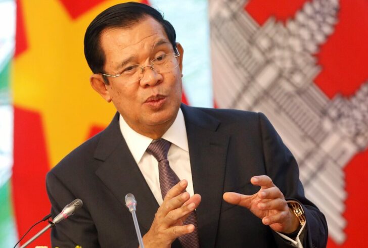 FILE PHOTO: Cambodia's Prime Minister Hun Sen speaks with media during a news conference at the Government Office in Hanoi