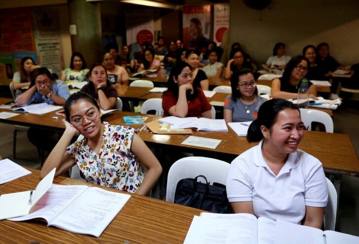 FILE PHOTO: Filipino workers, including nurses applying to work in United Kingdom, attend a lecture at a review center in Manila