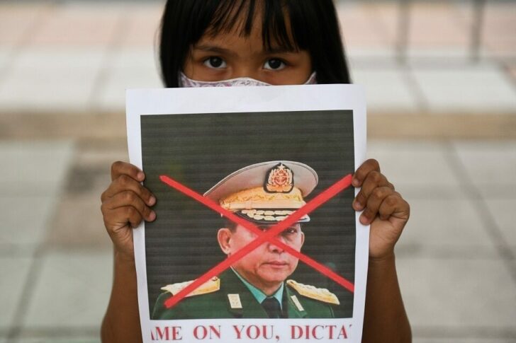 Myanmar citizens protest against the military coup in Myanmar outside United Nations venue, in Bangkok