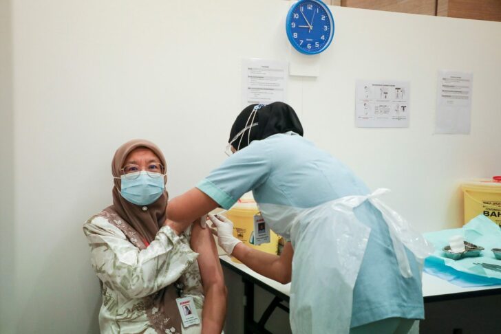A medical worker receives a vaccine for the coronavirus disease (COVID-19), at a vaccination centre in Sunway Medical Centre, in Subang Jaya