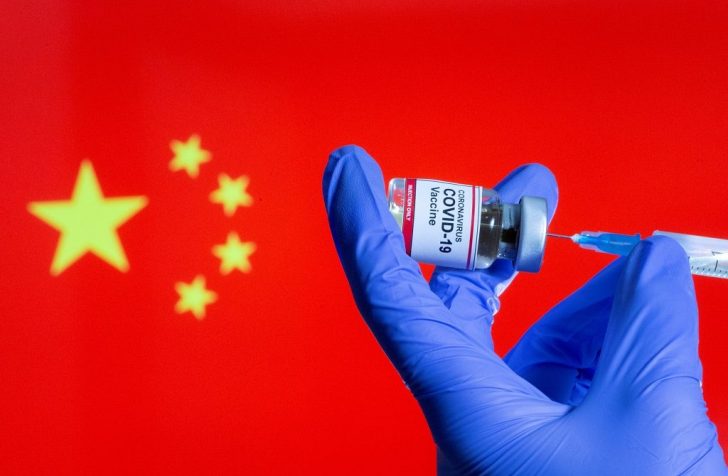 FILE PHOTO: FILE PHOTO: A woman holds a small bottle labeled with a