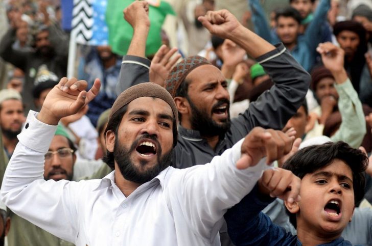Supporters of the Tehreek-e-Labaik Pakistan (TLP) Islamist political party chant slogans as they protest protest against the arrest of their leader in Lahore,