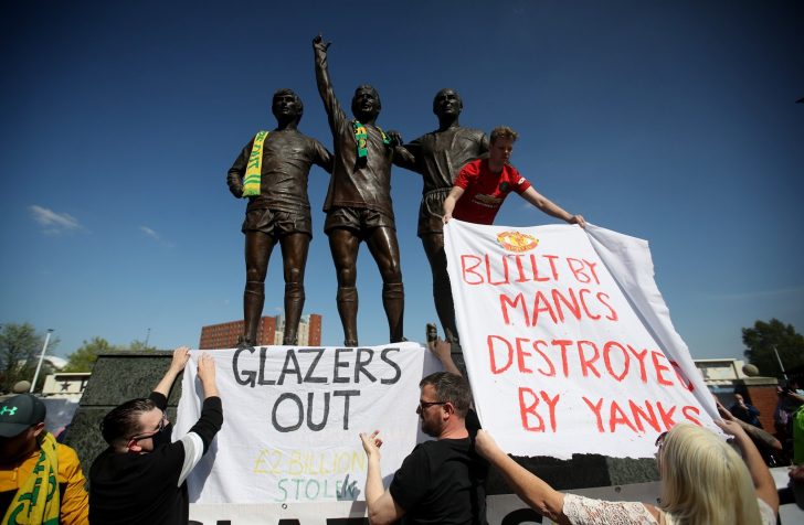 Manchester United fans protest against owners after failed launch of a European Super League