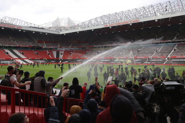 Manchester United fans protest against their owners before the Manchester United v Liverpool Premier League match