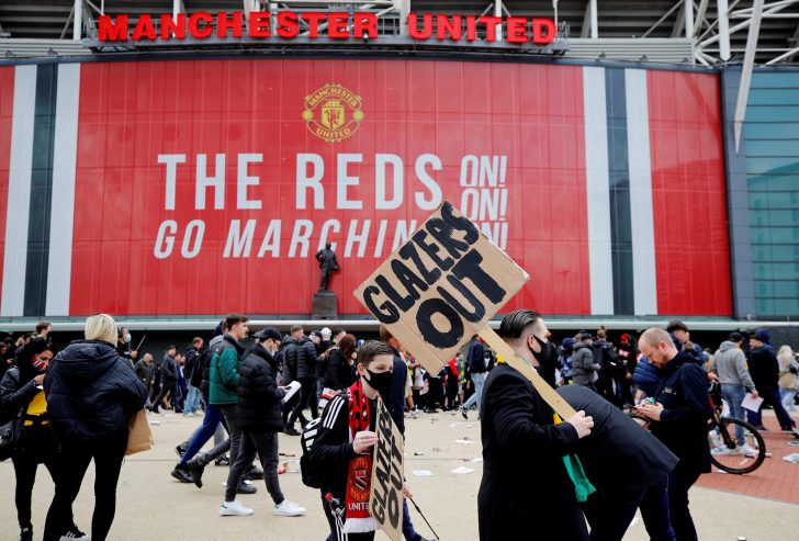 Manchester United fans protest against their owners before the Manchester United v Liverpool Premier League match