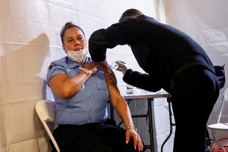 MTA security contractor Janet Santiago receives a free vaccination for the coronavirus disease (COVID-19) at the Coney Island subway station in Brooklyn, New York