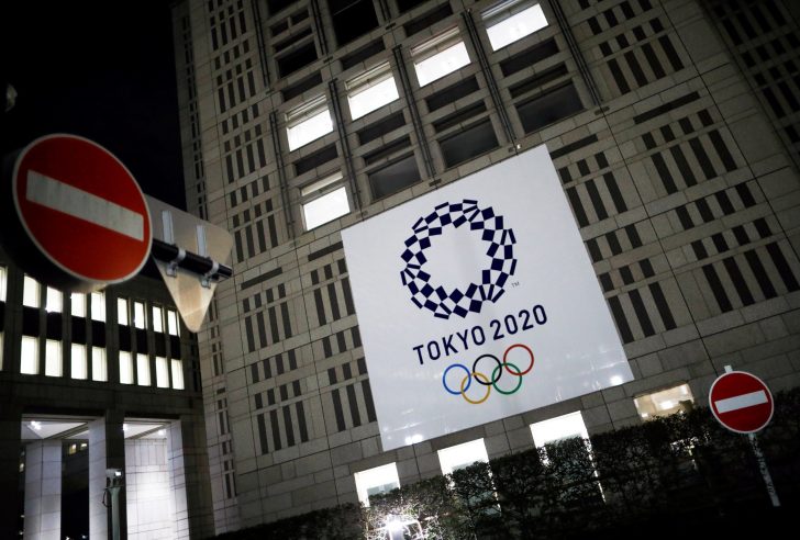 FILE PHOTO: The logo of Tokyo 2020 Olympic Games is seen through signboards, in Tokyo