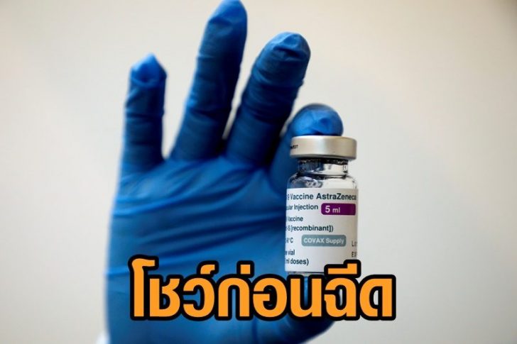 FILE PHOTO: A medical worker holds a bottle of AstraZeneca's COVID-19 vaccine at a vaccination centre in Kuala Lumpur