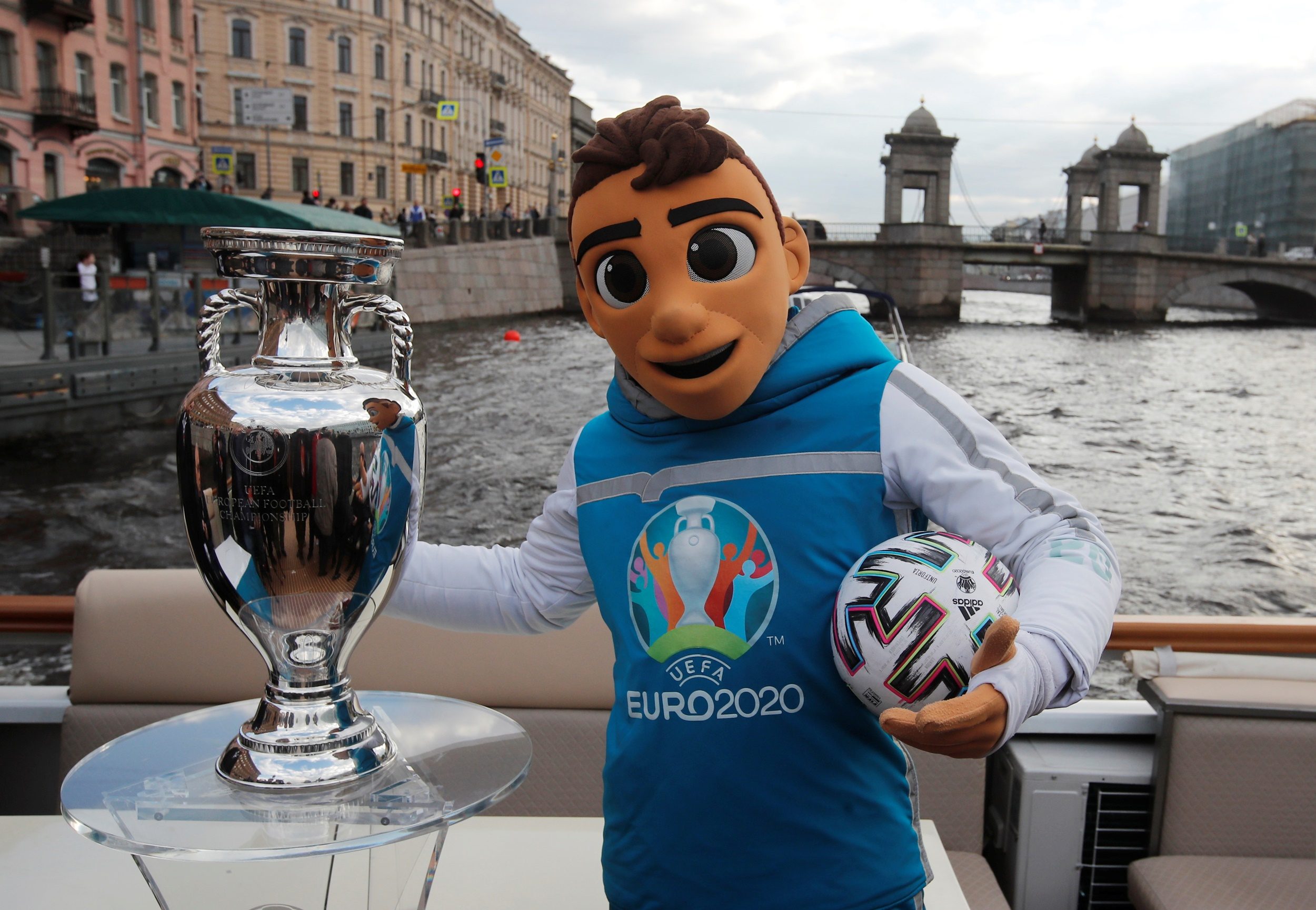 UEFA Euro 2020 mascot Skillzy poses with the trophy during a boat tour in  Saint Petersburg
