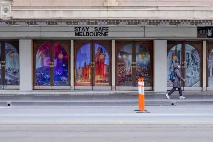 FILE PHOTO: A woman walks past a