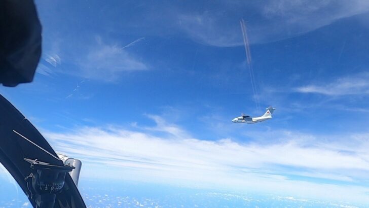 A plane with a Chinese flag on its tail is seen in this handout picture