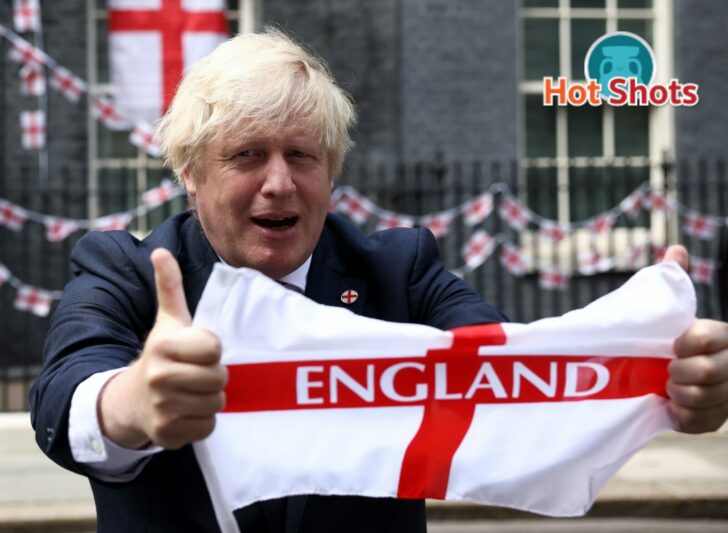 Britain's Boris Johnson at Downing Street with flags ahead of the Euro 2020 final