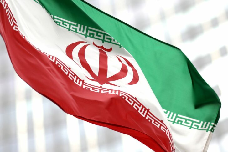 FILE PHOTO: Iranian flag flies in front of the UN office building in Vienna