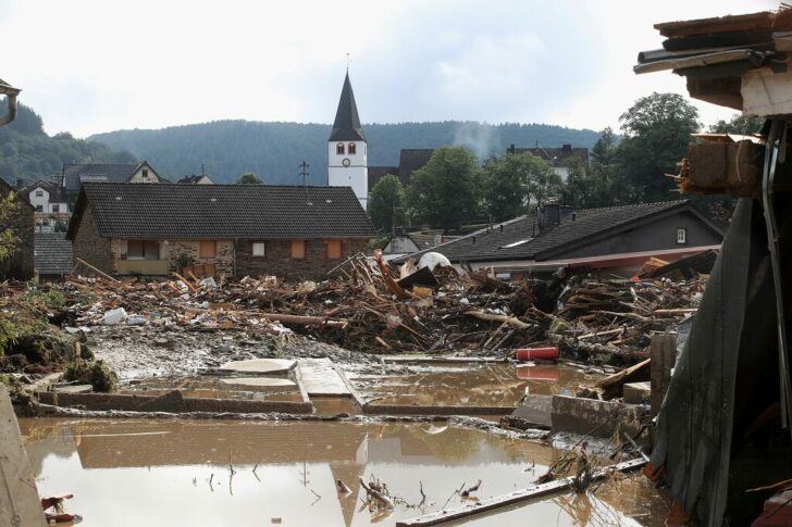 FILE PHOTO: Collapsed houses are seen on a flood-affected area following heavy rainfalls in Schuld