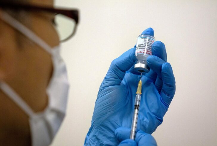 FILE PHOTO: Medical staff prepare Moderna coronavirus (COVID-19) vaccine in Tokyo