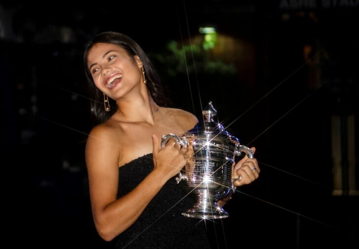 Britain's Emma Raducanu poses with the U.S. Open tennis championship trophy