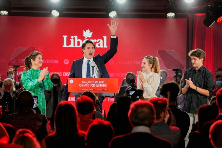 Canada's Liberal Prime Minister Justin Trudeau, accompanied by his wife Sophie Gregoire and their children Ella-Grace and Xavier, waves to supporters during the Liberal election night party in Montreal