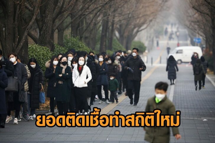 People wait in a long line to undergo coronavirus disease (COVID-19) test at a testing site in Seoul