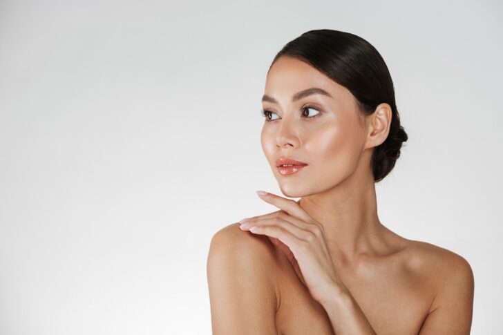 Beauty portrait of feminine young woman looking away and touchin
