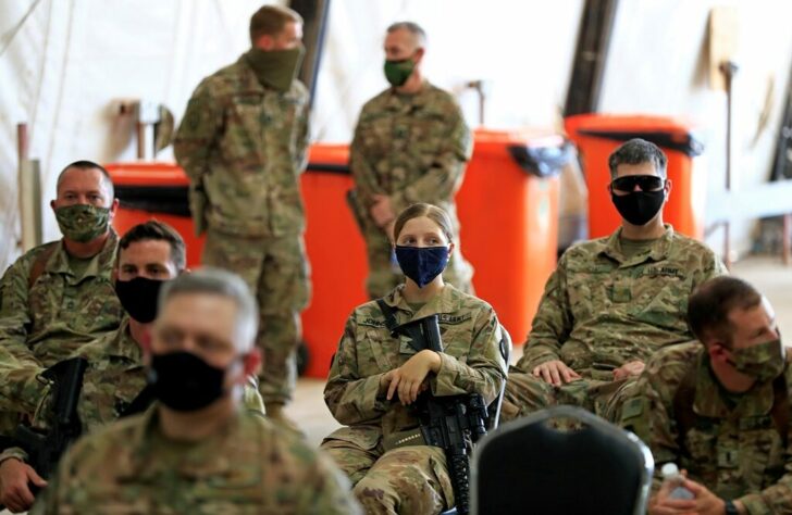 FILE PHOTO: U.S.-led troops withdraw from Iraq's Taji base