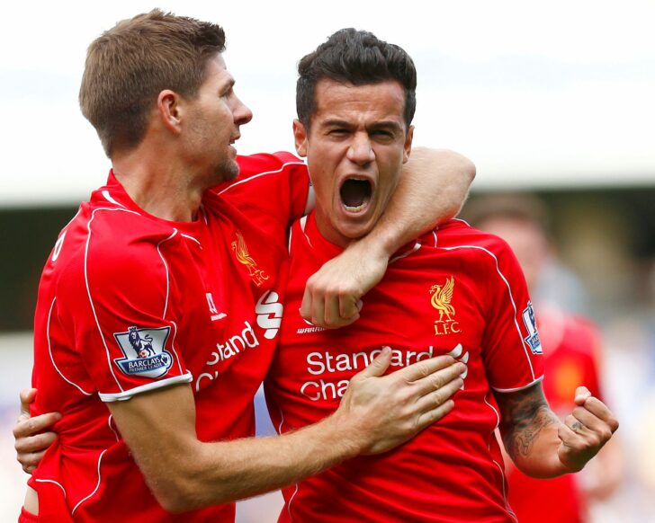 FILE PHOTO: Liverpool's Philippe Coutinho celebrates with Steven Gerrard after scoring during their English Premier League soccer match against Queens Park Rangers at Loftus Road in London