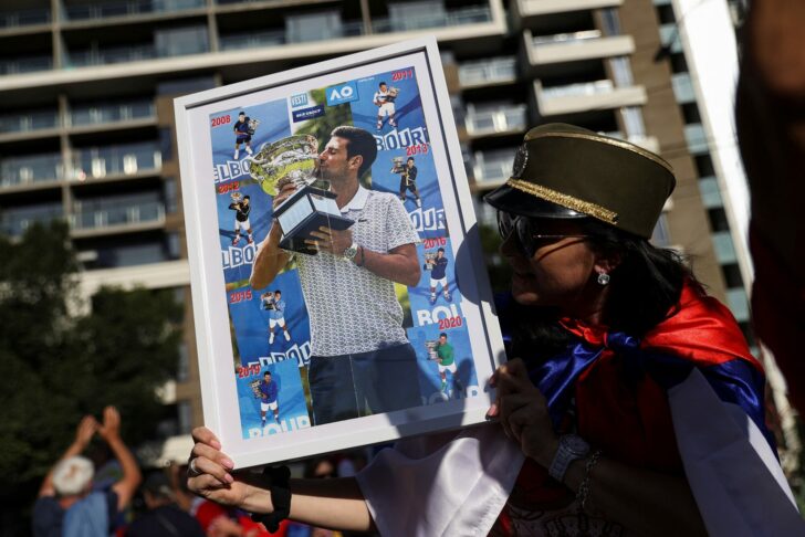 Supporters gather outside the hotel where Novak Djokovic is believed to be held in Melbourne