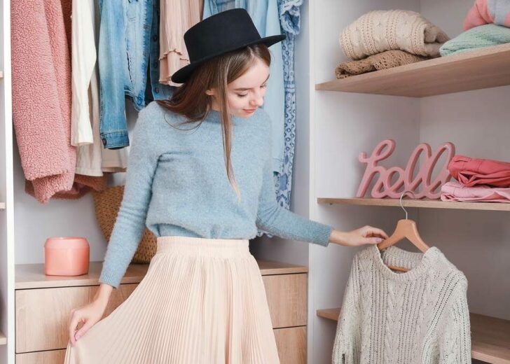Beautiful,Young,Woman,Choosing,Clothes,From,Large,Wardrobe