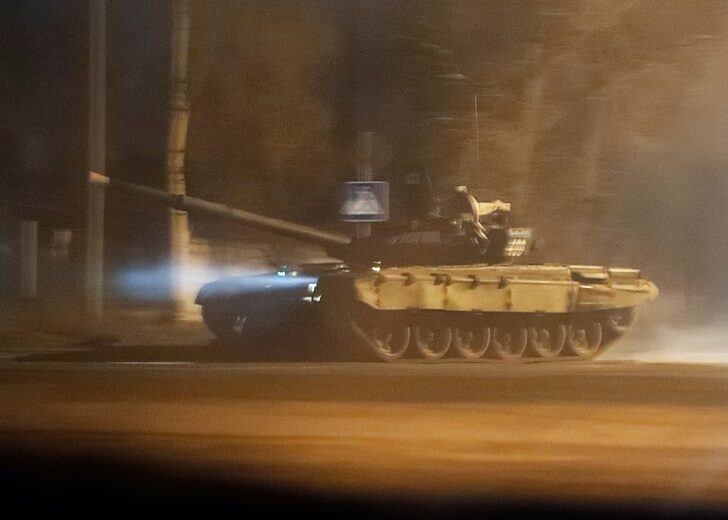 A tank drives along a street in Donetsk