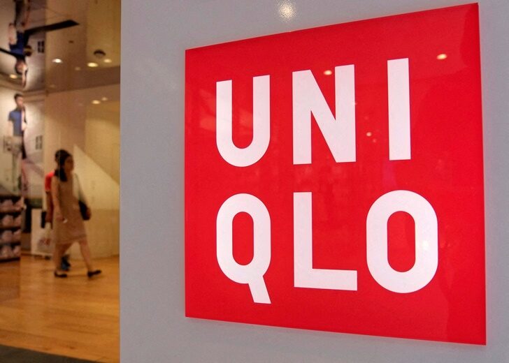 FILE PHOTO: FILE PHOTO: Shoppers walk inside Fast Retailing's Uniqlo casual clothing store in Tokyo