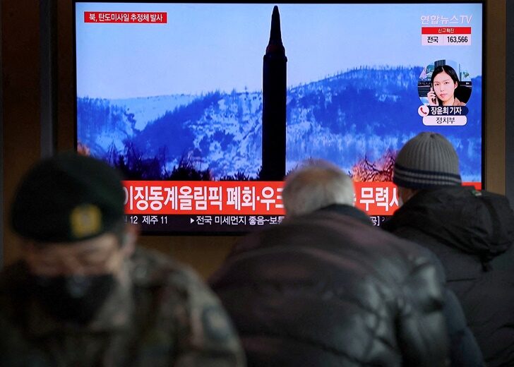 FILE PHOTO: FILE PHOTO: People watch a TV broadcasting file footage of a news report on North Korea firing what appeared to be a ballistic missile, in Seoul