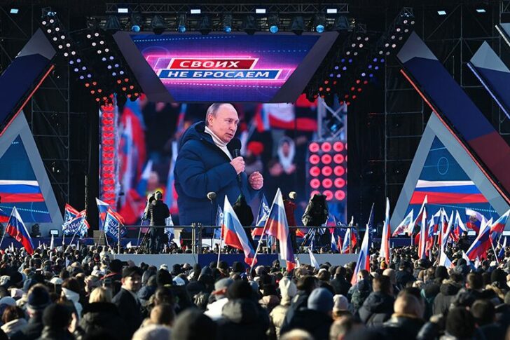 Russian President Vladimir Putin attends a concert marking the eighth anniversary of Russia's annexation of Crimea in Moscow
