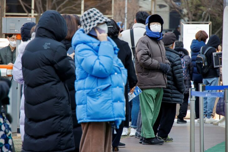 People wait in line for coronavirus disease (COVID-19) test in Seoul