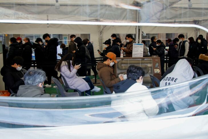 People wait in line for coronavirus disease (COVID-19) test in Seoul