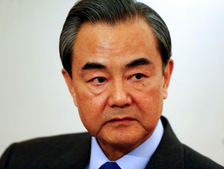FILE PHOTO: China's Foreign Minister Wang answers reporter's questions during a Reuters interview in Munich