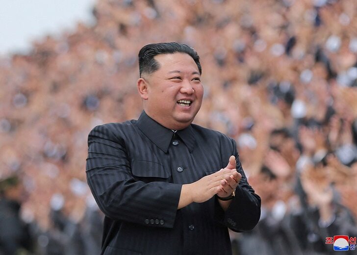 FILE PHOTO: North Korean leader Kim Jong Un applauds during a photo session with students and young workers in Pyongyang