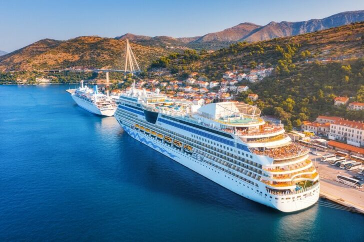 Aerial view of beautiful large white cruise ships at sunset